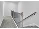 Upper floor hallway with gray carpeting and black iron railings at 4101 Fulson Dr, Lilburn, GA 30047