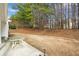 The backyard features a large patio and wooded perimeter at 661 Towering Pine Se Trl, Lawrenceville, GA 30045