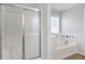 Bright bathroom featuring a shower, garden tub, and ample natural light at 661 Towering Pine Se Trl, Lawrenceville, GA 30045