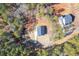 Aerial view of two homes nestled in a wooded area at 130 Wesley Pl, Fayetteville, GA 30214