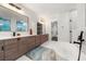 Modern bathroom with double vanity and free-standing tub at 130 Wesley Place, Fayetteville, GA 30214