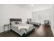 Basement bedroom with two beds and dark hardwood floors at 130 Wesley Place, Fayetteville, GA 30214