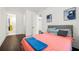 Cozy bedroom with coral bedding and dark hardwood floors at 130 Wesley Place, Fayetteville, GA 30214