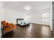 Bright bedroom with dark hardwood floors and a comfortable sitting area at 130 Wesley Place, Fayetteville, GA 30214