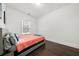 Bright bedroom with coral bedding and dark hardwood floors at 130 Wesley Place, Fayetteville, GA 30214