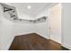 Spacious closet with dark hardwood floors and hanging shelves at 130 Wesley Pl, Fayetteville, GA 30214