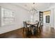 Bright dining room with hardwood floors and modern chandelier at 130 Wesley Pl, Fayetteville, GA 30214