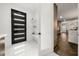 Modern entryway with black door and built-in shelving at 130 Wesley Place, Fayetteville, GA 30214