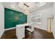 Modern home office features green accent wall and ample natural light at 130 Wesley Pl, Fayetteville, GA 30214