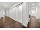 Second floor laundry room with barn door and white walls at 130 Wesley Pl, Fayetteville, GA 30214