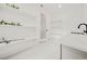 Bright laundry room with white cabinets and quartz countertops at 130 Wesley Place, Fayetteville, GA 30214