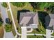 Aerial view of a home with a well-maintained roof, landscaping, and driveway at 1553 Brunswick St, Lithia Springs, GA 30122