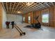 Unfinished basement with exercise equipment at 1553 Brunswick St, Lithia Springs, GA 30122