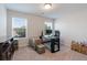 Bedroom with two windows, desk and boxes, showcasing ample space for work at 1553 Brunswick St, Lithia Springs, GA 30122