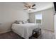 Cozy bedroom with a ceiling fan, large bed, and a window for natural light at 1553 Brunswick St, Lithia Springs, GA 30122