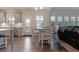 Open dining area with a table set, blending seamlessly with the kitchen and living area at 1553 Brunswick St, Lithia Springs, GA 30122