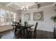 Elegant dining room with stylish decor, hardwood floors, and bright windows at 1553 Brunswick St, Lithia Springs, GA 30122