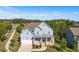 Inviting two-story home with a covered front porch, pristine lawn, and blue siding at 1553 Brunswick St, Lithia Springs, GA 30122