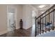 Hallway view of a bathroom and arched doorway at 1553 Brunswick St, Lithia Springs, GA 30122