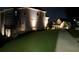 Night view of house exterior, deck, and walkway at 1553 Brunswick St, Lithia Springs, GA 30122