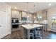 Modern kitchen with island and stainless steel appliances at 1553 Brunswick St, Lithia Springs, GA 30122