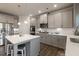 Modern kitchen with gray cabinets, white countertops and island at 1553 Brunswick St, Lithia Springs, GA 30122