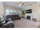 Spacious living room with sectional sofa and fireplace at 1553 Brunswick St, Lithia Springs, GA 30122