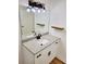 Updated bathroom features granite countertop, modern vanity, and stylish light fixture at 300 E Campbellton E St, Fairburn, GA 30213