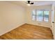 Spacious bedroom with wood-look floors and large window at 300 E Campbellton E St, Fairburn, GA 30213