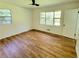 Bright bedroom with wood-look floors and large window at 300 E Campbellton E St, Fairburn, GA 30213