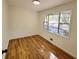 Bright bedroom with wood-look floors and large window at 300 E Campbellton E St, Fairburn, GA 30213