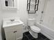 Clean bathroom with white vanity, toilet, and bathtub at 355 Holland Springs Way, Powder Springs, GA 30127