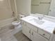 Small bathroom with white vanity and gray tile floor at 355 Holland Springs Way, Powder Springs, GA 30127