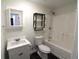 Clean bathroom with a white vanity, bathtub and shower at 355 Holland Springs Way, Powder Springs, GA 30127