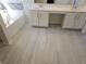 Bathroom with gray wood-look tile floor and white vanity at 355 Holland Springs Way, Powder Springs, GA 30127