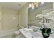 Bathroom with a shower-tub combo, vanity, and white quartz countertops at 355 Holland Springs Way, Powder Springs, GA 30127