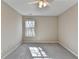 This bedroom features neutral walls, carpet floors, and a ceiling fan for added comfort at 355 Holland Springs Way, Powder Springs, GA 30127