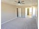 Spacious bedroom with carpet flooring and ceiling fan at 355 Holland Springs Way, Powder Springs, GA 30127