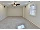 Bright bedroom featuring carpeted floors, neutral walls and a ceiling fan at 355 Holland Springs Way, Powder Springs, GA 30127