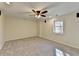 Bedroom featuring carpeted floors, neutral walls and a ceiling fan at 355 Holland Springs Way, Powder Springs, GA 30127