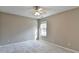 Bedroom with gray walls, gray carpet, a ceiling fan, and a window at 355 Holland Springs Way, Powder Springs, GA 30127