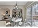 Cozy breakfast nook with sliding doors to deck, and arched doorway to living room at 355 Holland Springs Way, Powder Springs, GA 30127