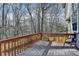 Comfortable deck with wooded view offers perfect space for relaxation and entertainment at 355 Holland Springs Way, Powder Springs, GA 30127