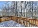 View from a wooden deck overlooking a wooded backyard, a tranquil outdoor retreat at 355 Holland Springs Way, Powder Springs, GA 30127