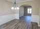 Bright dining room with hardwood floors and elegant chandelier at 355 Holland Springs Way, Powder Springs, GA 30127