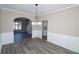 Bright dining room with hardwood floors and an open concept design at 355 Holland Springs Way, Powder Springs, GA 30127