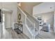 Open foyer showcasing a staircase, neutral decor, and hardwood flooring at 355 Holland Springs Way, Powder Springs, GA 30127