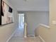 Upstairs hallway with carpet flooring, and neutral paint at 355 Holland Springs Way, Powder Springs, GA 30127