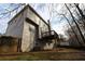 Two story house exterior with deck and wooded backyard at 355 Holland Springs Way, Powder Springs, GA 30127