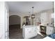 Open concept kitchen with white cabinets and quartz countertops at 355 Holland Springs Way, Powder Springs, GA 30127